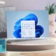 image of laptop displaying the windows 11 2020 update on office desk