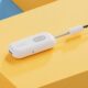 A white wireless twelve south headphone adapter with a plus and minus button lies on a dual-shade yellow background, with text "AirFly" printed on its side.
